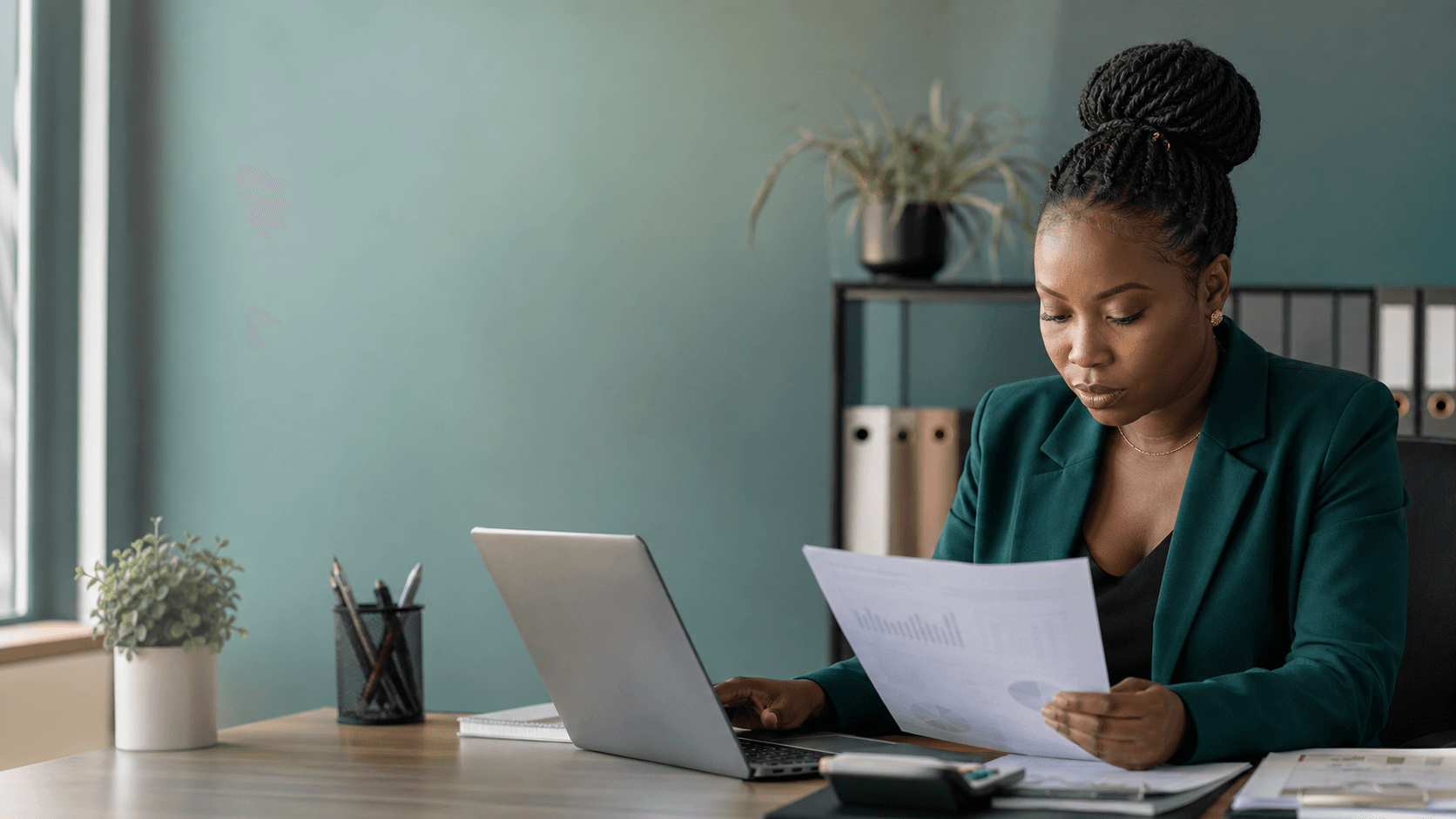 An accountant reviewing financial reports in an office